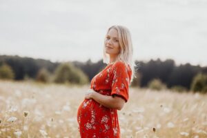Pregnant woman in a field