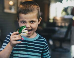 kid holding teeth